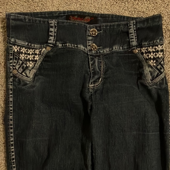 Two pairs of jeans.Both are brand new with no tags.Have cool designs aswell. - Picture 6 of 8